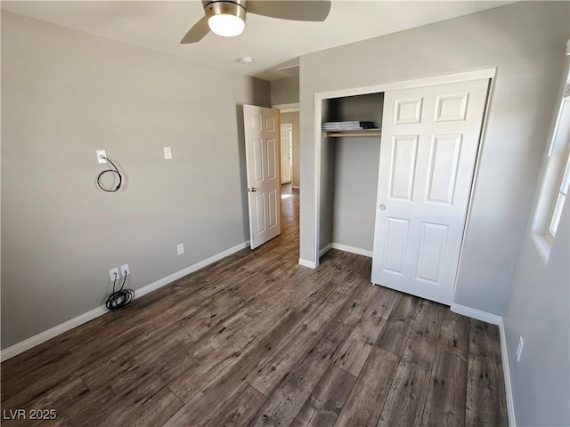 unfurnished bedroom featuring a closet, a ceiling fan, baseboards, and wood finished floors