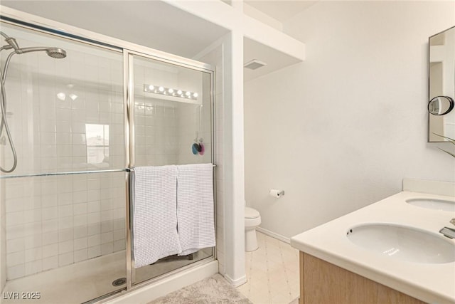 bathroom with a sink, visible vents, toilet, and a stall shower