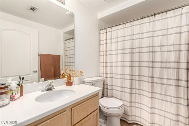 full bath featuring visible vents, toilet, and vanity