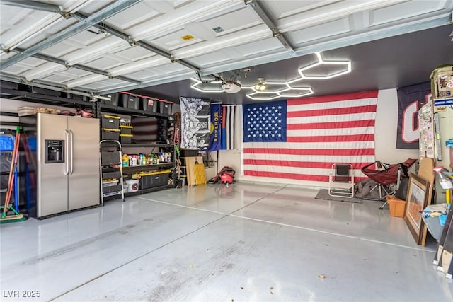 garage featuring stainless steel fridge