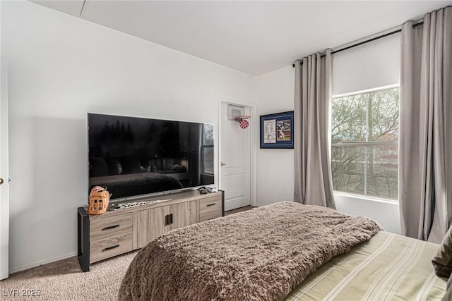 bedroom featuring light carpet