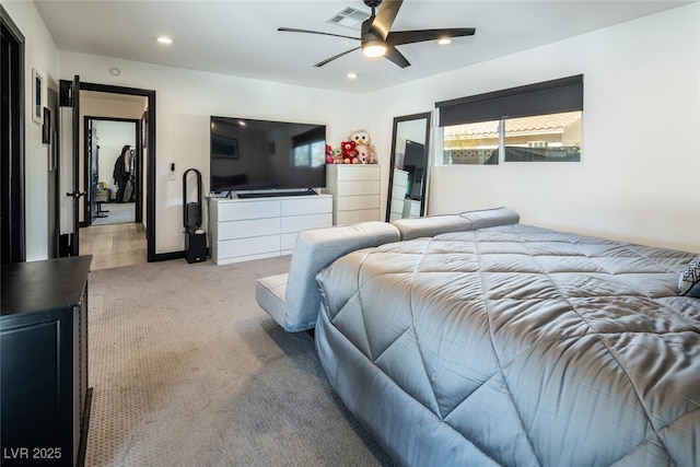 bedroom with ceiling fan, recessed lighting, visible vents, and light carpet