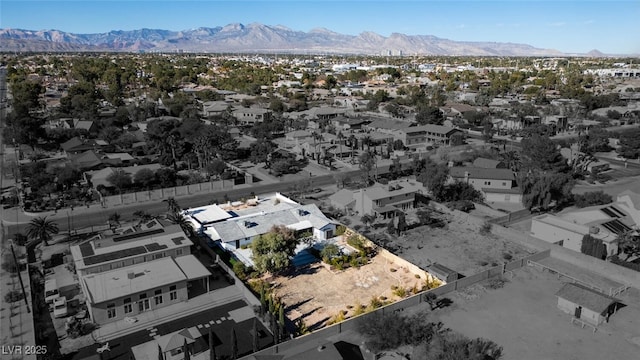 birds eye view of property featuring a mountain view and a residential view