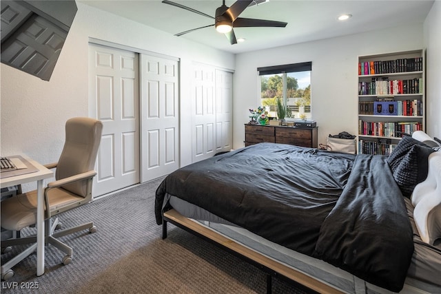 bedroom featuring recessed lighting, two closets, carpet, and ceiling fan