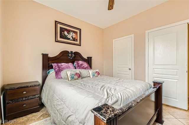 bedroom with light tile patterned flooring and a ceiling fan