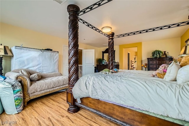 bedroom with wood finished floors