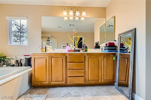 bathroom featuring double vanity, visible vents, a garden tub, and tile patterned flooring