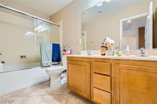 bathroom with tile patterned flooring, visible vents, toilet, double vanity, and enclosed tub / shower combo