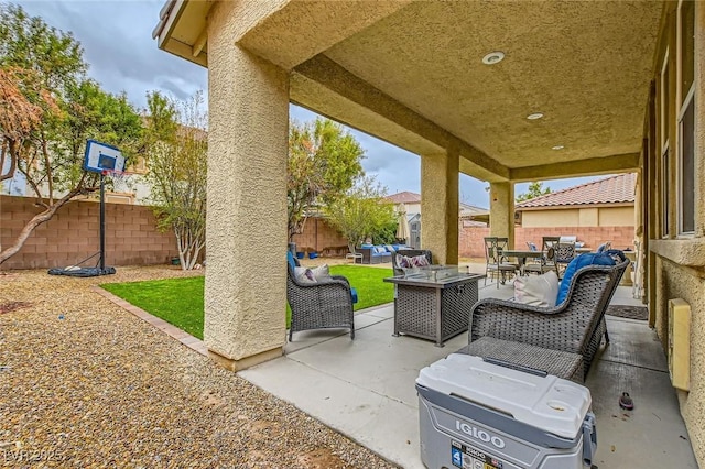 view of patio with outdoor dining area, a fenced backyard, and an outdoor hangout area