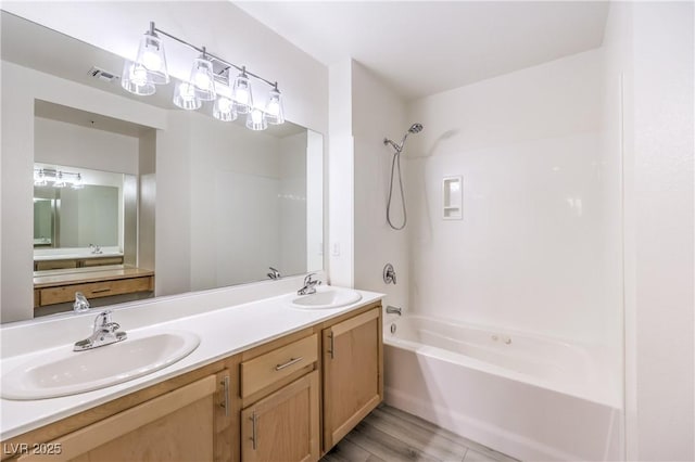 full bathroom featuring double vanity, visible vents, shower / bathtub combination, and a sink