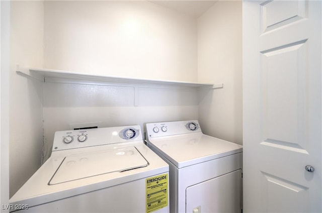 laundry area with washing machine and clothes dryer