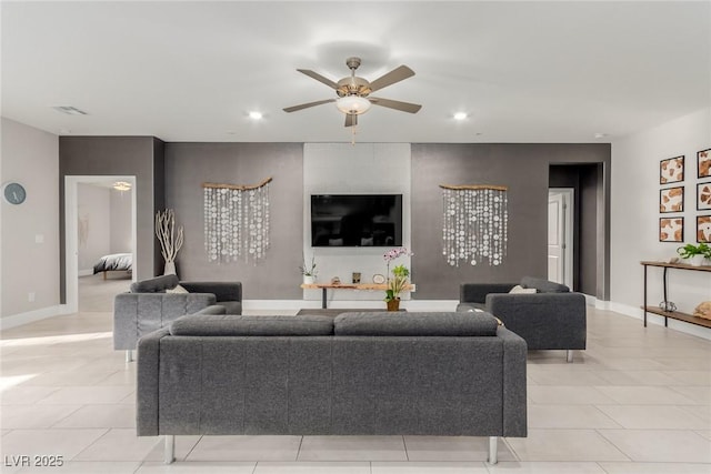 living room with recessed lighting, ceiling fan, and baseboards