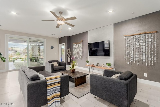 living room with recessed lighting, a ceiling fan, baseboards, and light tile patterned floors