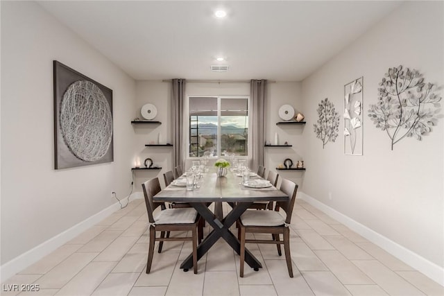 dining area with light tile patterned floors, visible vents, baseboards, and recessed lighting