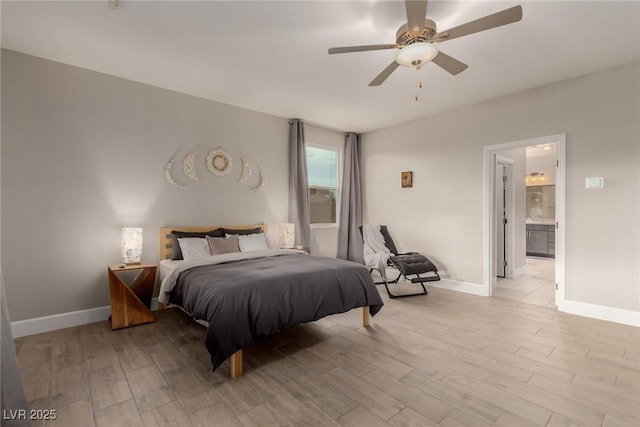 bedroom featuring a ceiling fan, baseboards, light wood-type flooring, and ensuite bathroom