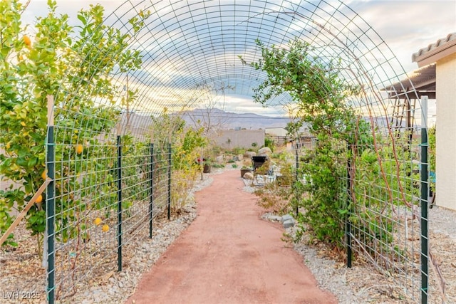 view of community featuring fence