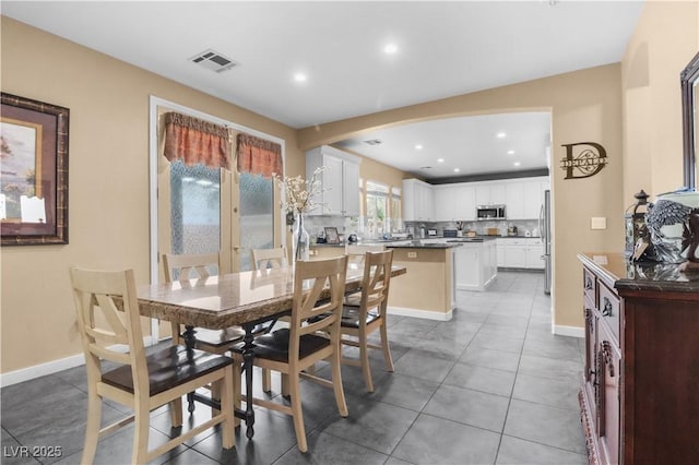 dining area with recessed lighting, light tile patterned floors, baseboards, and visible vents