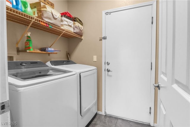 washroom with separate washer and dryer and laundry area