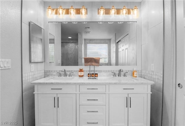 bathroom with double vanity and a sink