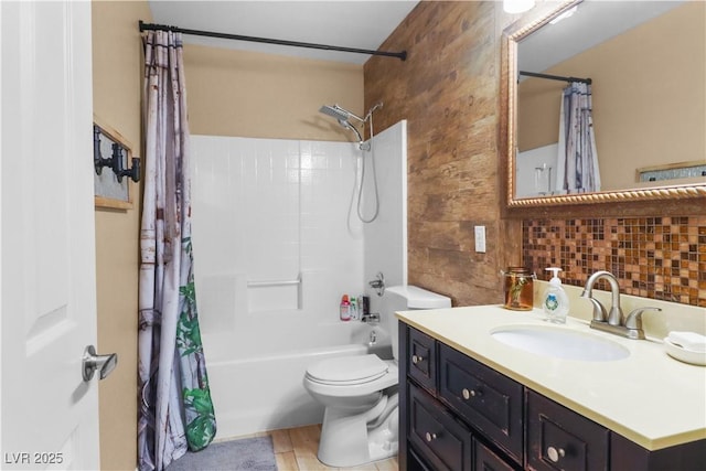 full bathroom with vanity, shower / tub combo, and toilet