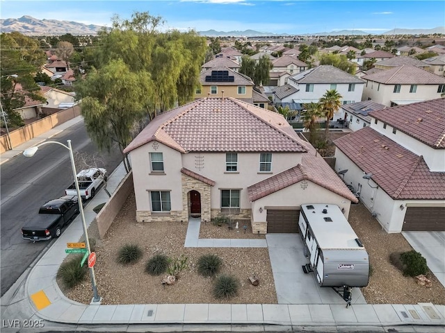 drone / aerial view with a mountain view and a residential view