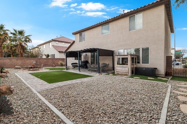 back of house featuring a patio area, a fenced backyard, a pergola, and stucco siding