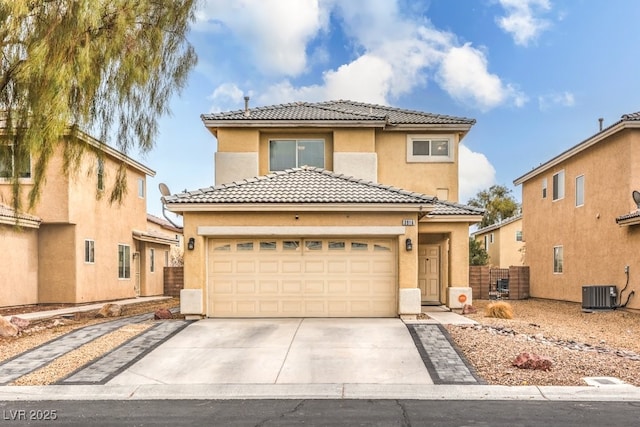 view of front of home with stucco siding, driveway, a tile roof, fence, and central AC unit