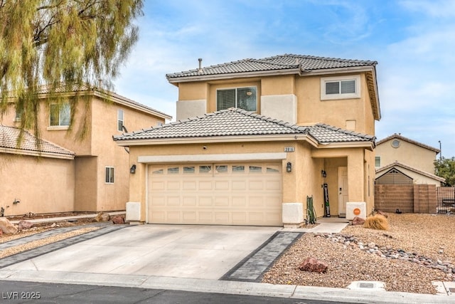 view of front of property featuring stucco siding, fence, concrete driveway, and a tile roof