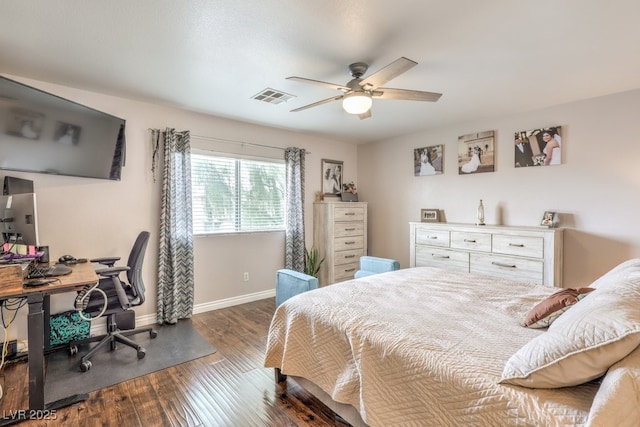 bedroom with ceiling fan, visible vents, baseboards, and wood finished floors