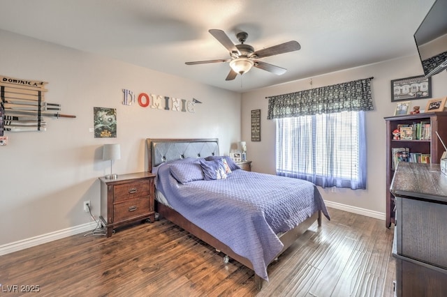 bedroom with baseboards, wood finished floors, and a ceiling fan