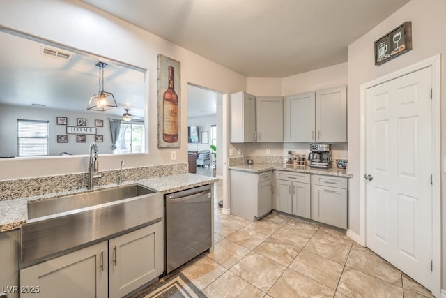 kitchen featuring light stone counters, visible vents, gray cabinets, a sink, and stainless steel dishwasher