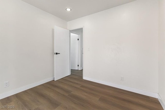 unfurnished room with recessed lighting, baseboards, and wood finished floors