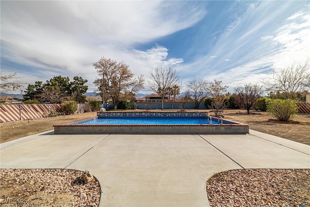 view of swimming pool with a fenced in pool, a patio, and a fenced backyard