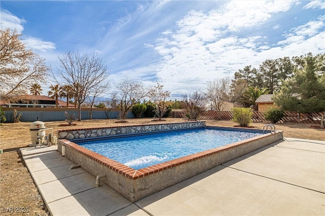 view of pool featuring a fenced in pool, a patio, and a fenced backyard