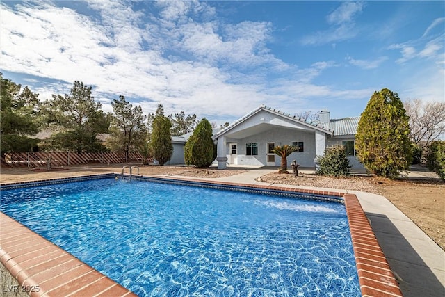 view of pool featuring a patio, a fenced in pool, and fence