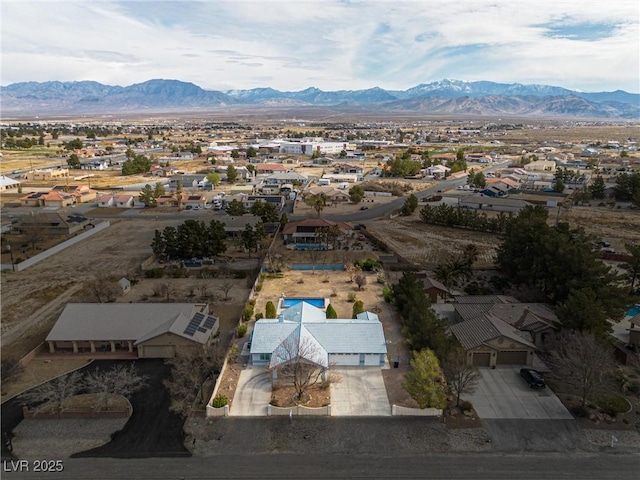 drone / aerial view with a residential view and a mountain view