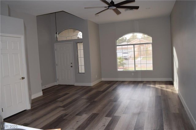 foyer entrance featuring ceiling fan, baseboards, and wood finished floors