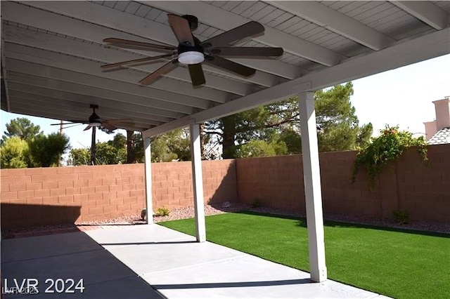 view of patio with a fenced backyard and a ceiling fan