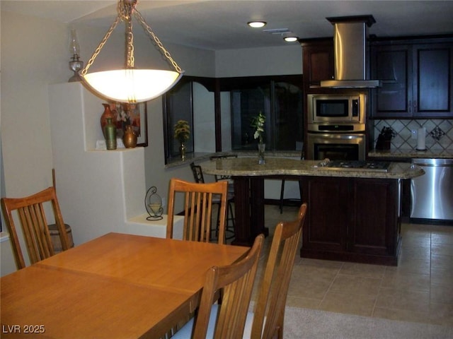 dining space featuring light tile patterned floors