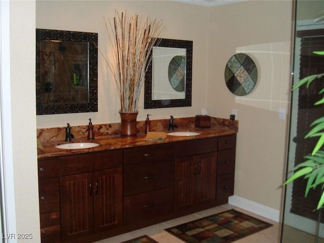 full bathroom featuring a sink, an enclosed shower, and double vanity