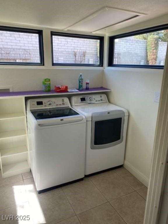 washroom with laundry area, independent washer and dryer, and plenty of natural light