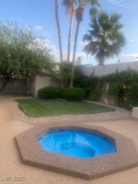 view of swimming pool with fence