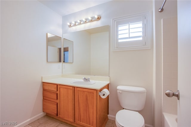 bathroom with vanity, baseboards, shower / tub combination, tile patterned floors, and toilet