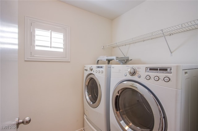 laundry room with washing machine and dryer and laundry area