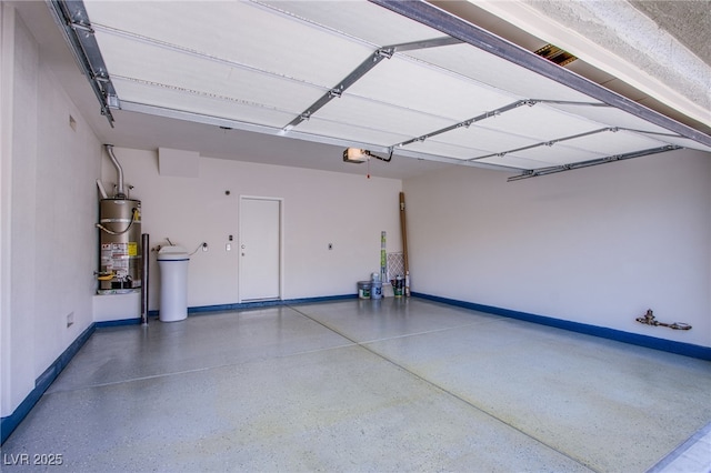 garage featuring gas water heater, a garage door opener, and baseboards