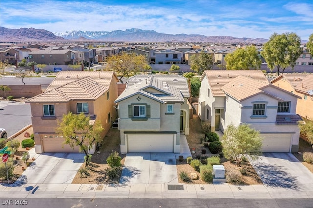 bird's eye view with a residential view and a mountain view