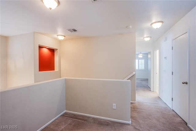 carpeted spare room with visible vents