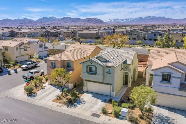 drone / aerial view with a residential view and a mountain view