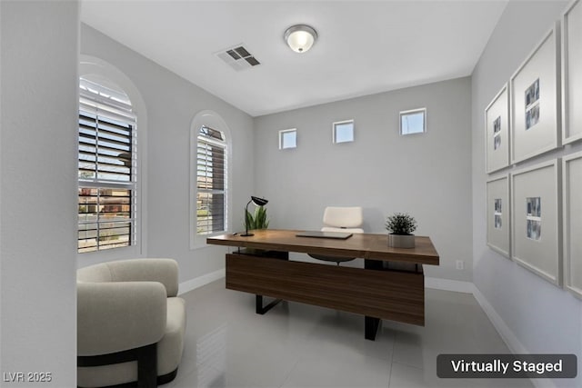 office area featuring visible vents and baseboards