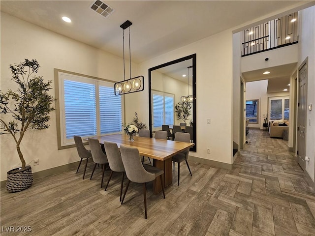 dining area featuring recessed lighting, visible vents, baseboards, and parquet floors